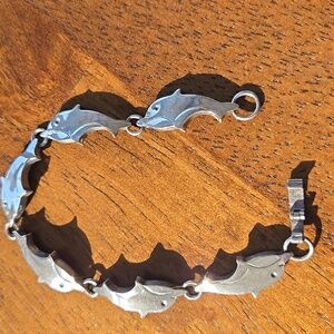 Silver Dolphin bracelet.